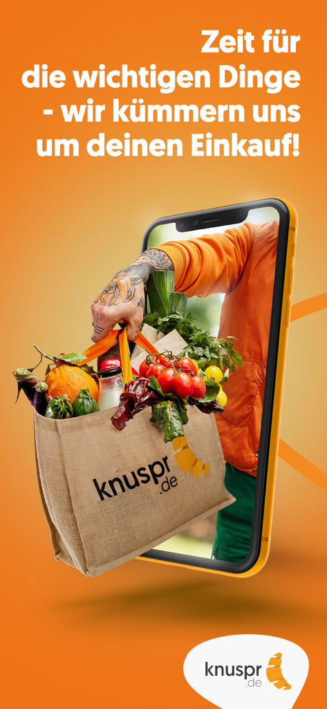 Knuspr.de - Uma pessoa segurando uma sacola de mantimentos frescos saindo da tela de um smartphone