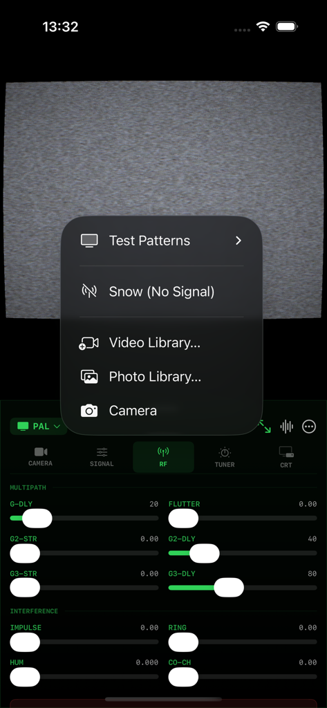 AnalogTV - Screenshot of AnalogTV app showing RF signal interference sliders and a source selection menu over a static CRT screen