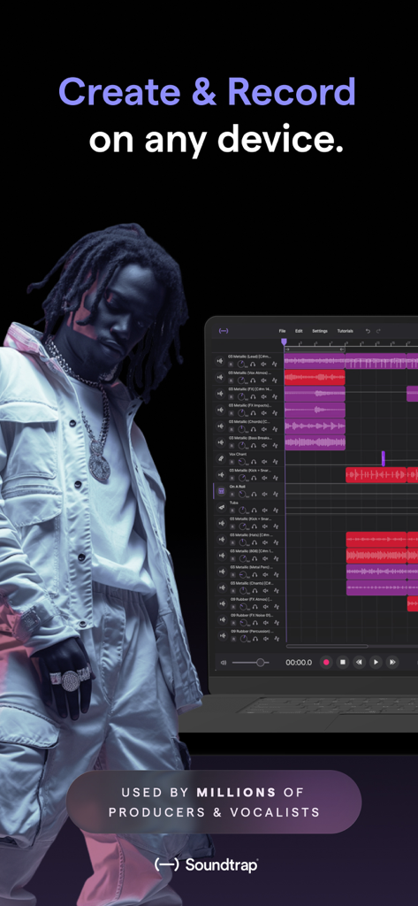 A young creative artist standing next to a laptop displaying the Soundtrap music production interface with multiple audio tracks