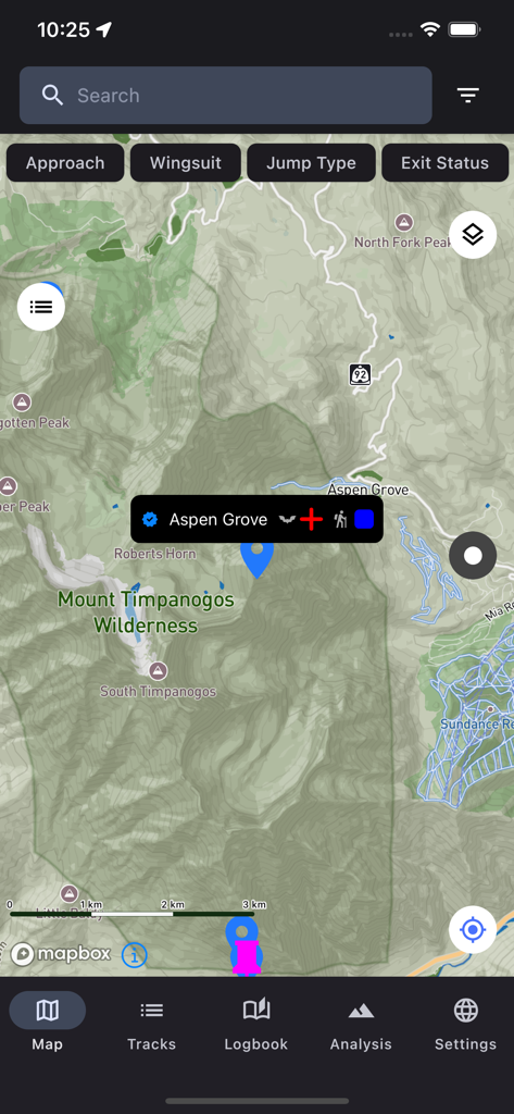Interfaz de la aplicación BaseBeta mostrando un mapa topográfico con marcadores de puntos de salida de salto BASE y filtros de búsqueda
