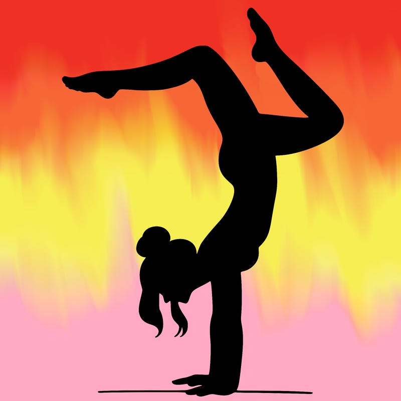 a woman doing a handstand