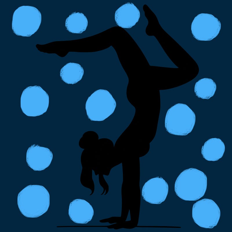 a woman doing a handstand