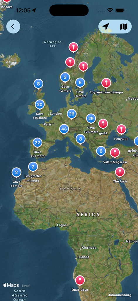Cave Map - Satellite map view showing cave markers and location clusters across Europe and Africa in the Cave Map app.