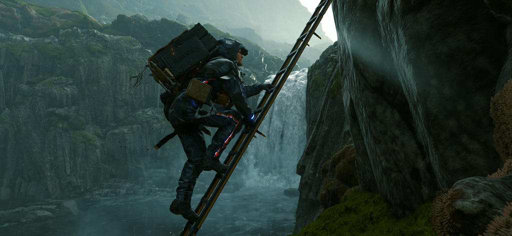 Sam Bridges climbing a long ladder up a rocky cliff with a waterfall in the background