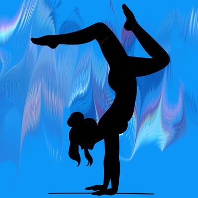 a woman doing a handstand