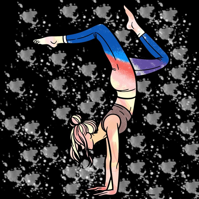 a woman doing a handstand