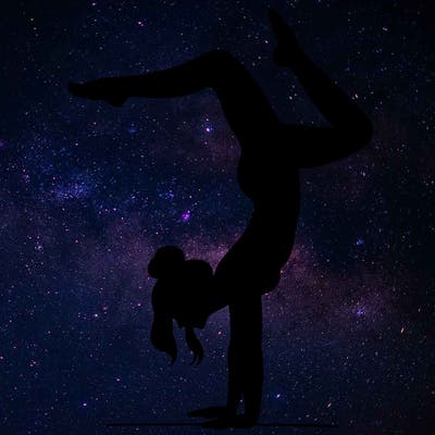 a woman doing a handstand