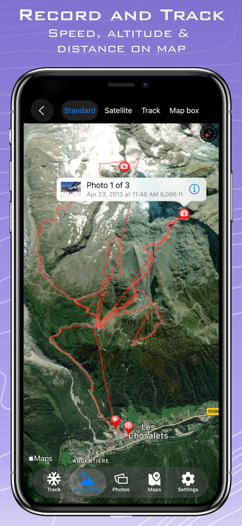 A smartphone showing a satellite map of a mountain with a recorded ski path and altitude data