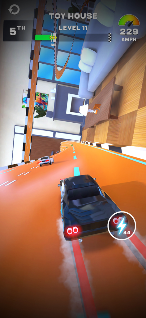 MR RACER : Stunt Mania - A black car racing on an orange stunt track in a toy house themed level