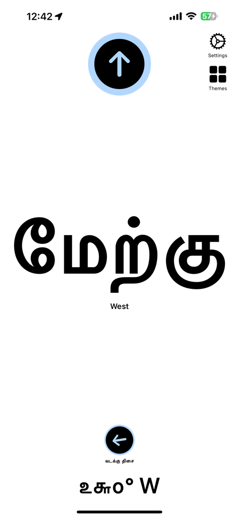 Tamil Directions Compass app interface showing the word West in large Tamil script and English with a minimalist design.