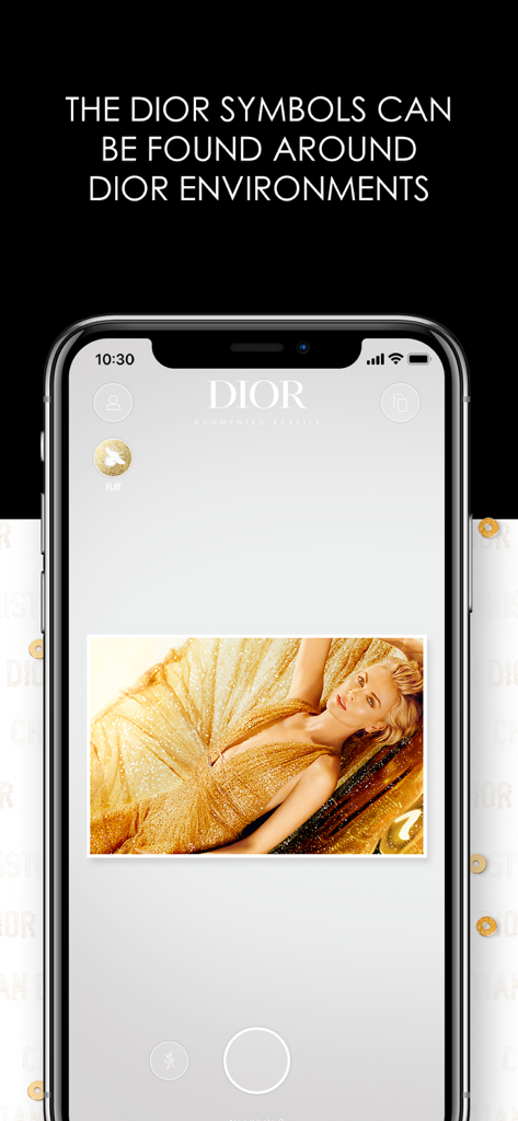 Dior AR Experience - Dior AR Experience app on iPhone scanning a gold luxury brand symbol