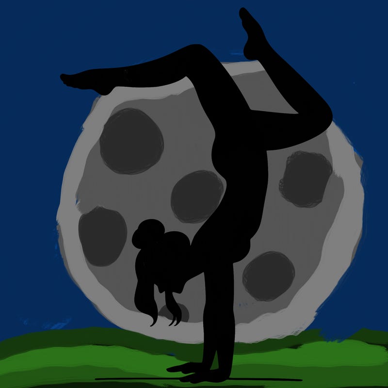 a woman doing a handstand