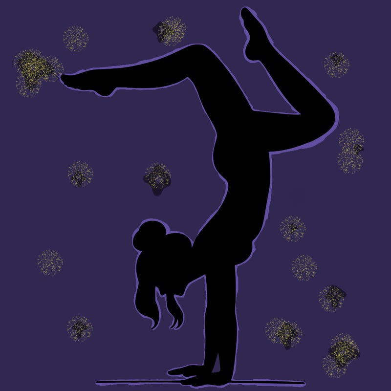 a woman doing a handstand