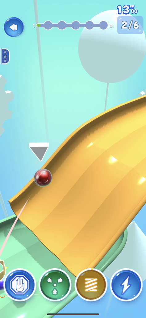 A red marble racing down a yellow curved 3D track with power up icons on the screen.
