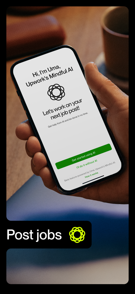 Upwork - A person holding a smartphone showing the Upwork app screen with an AI assistant to help post jobs.