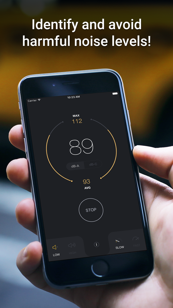 Hand holding an iPhone displaying the dB Decibel Meter app interface showing a sound level of 89 decibels
