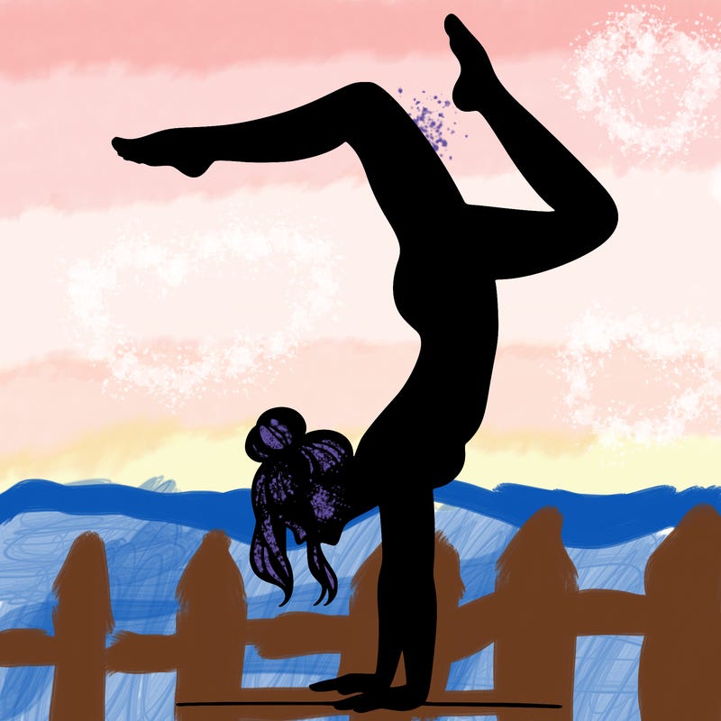 a woman doing a handstand