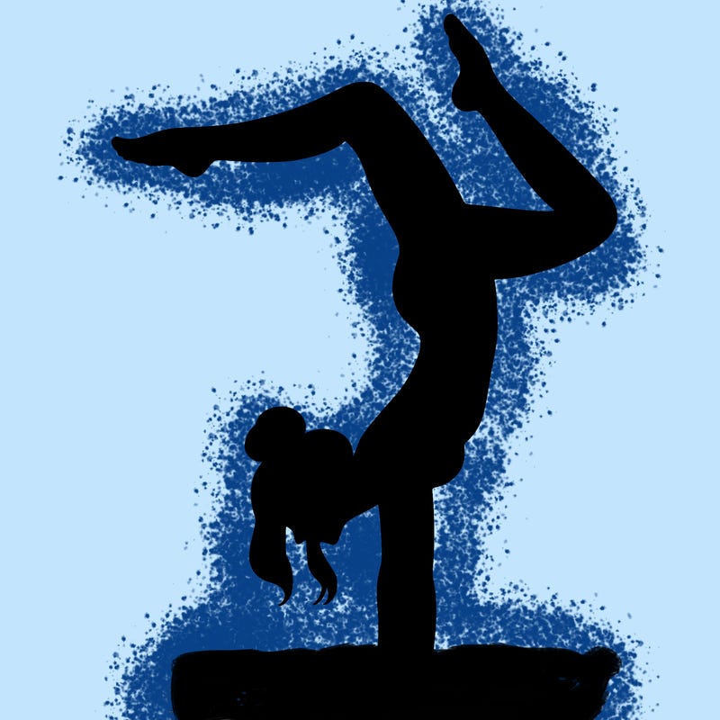 a woman doing a handstand