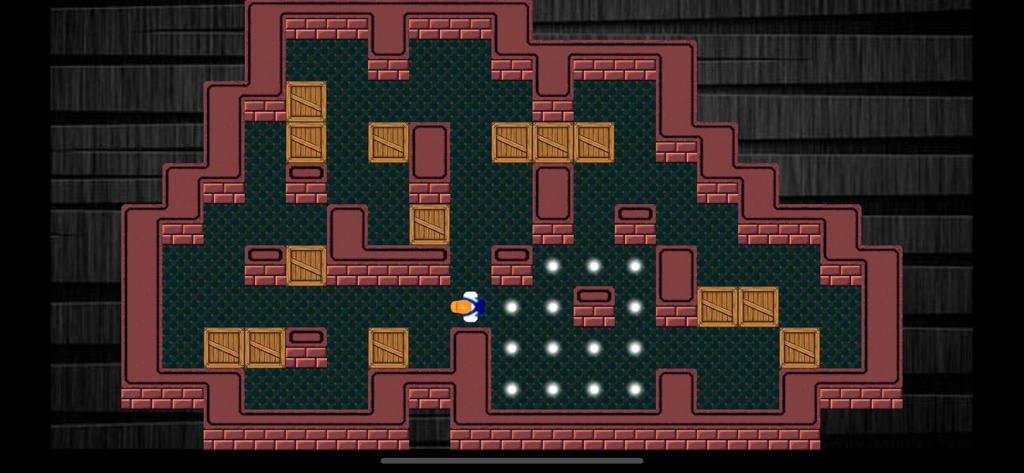 Sokoban (Boxman) Classic - Una vista de arriba hacia abajo de un nivel del juego de puzzle Sokoban Boxman Classic con cajas de madera y puntos de destino.