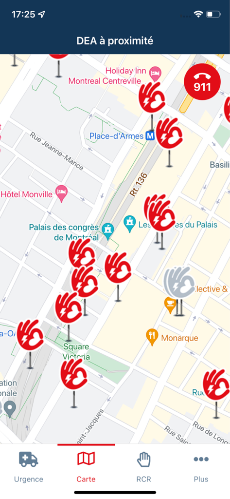 A map interface in the AED Quebec app displaying multiple nearby automated external defibrillator locations in Montreal with a 911 emergency button.