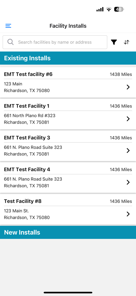 ENTOUCH Installer Tool app showing a list of existing facility installations with search and filter options.