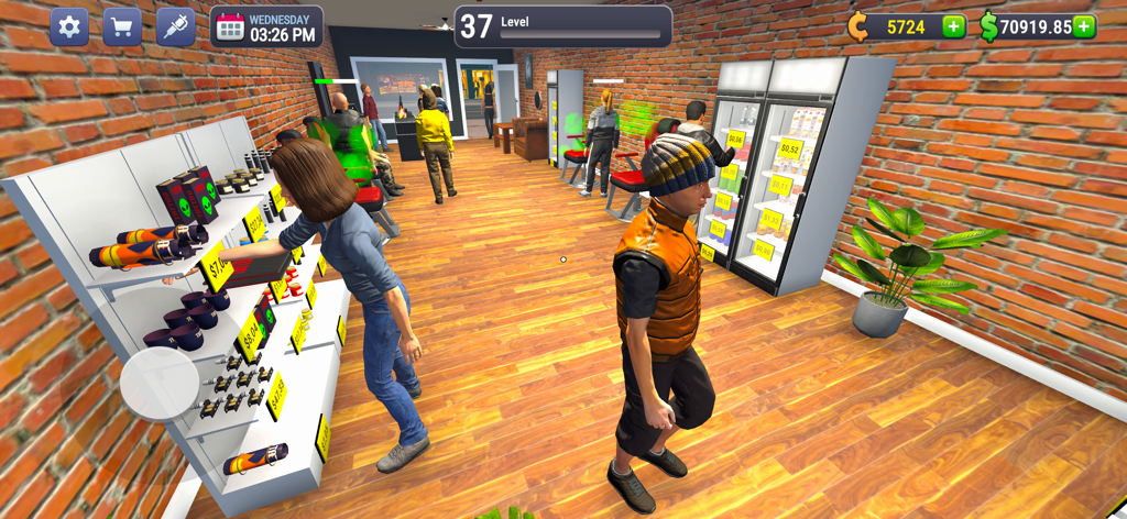 Una vista 3D del interior de un estudio de tatuajes que muestra a los clientes mirando estanterías de equipamiento y a los artistas trabajando en clientes en el juego simulador