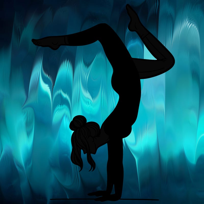 a woman doing a handstand