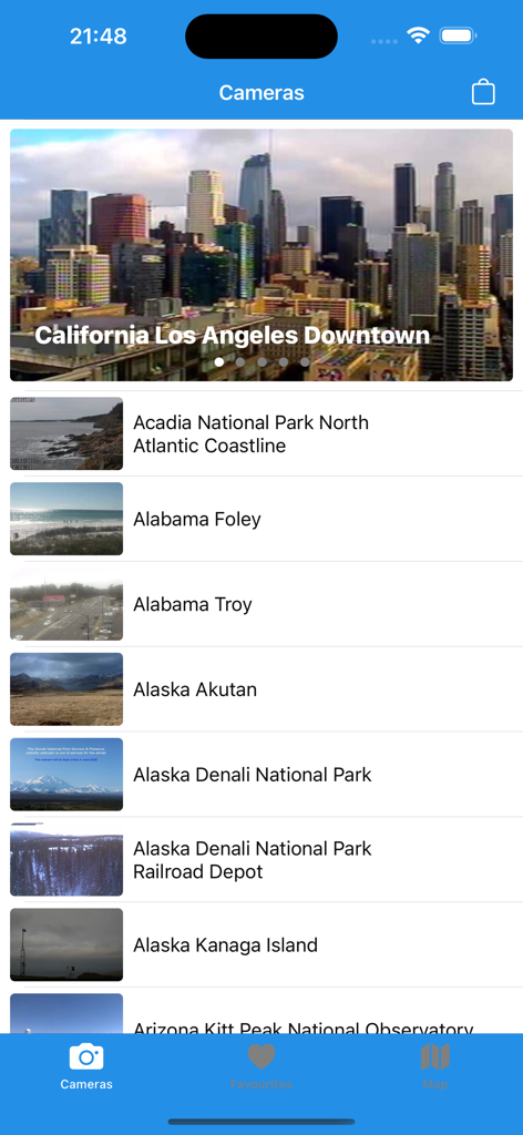 A list of live webcam feeds from across the United States in the USA Cameras app interface.