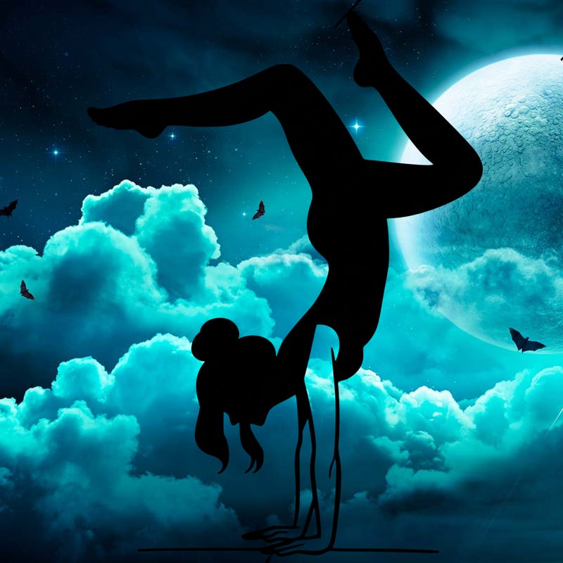 a woman doing a handstand