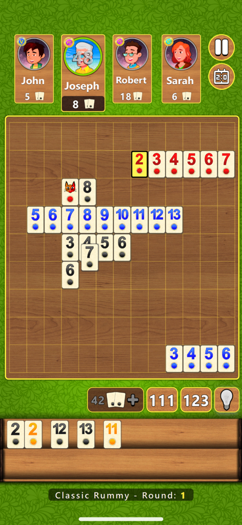 Classic Rummy game screen showing colorful numbered tiles on a wooden board with computer player avatars