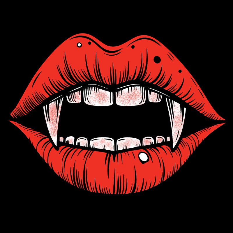 lips with vampire teeth
