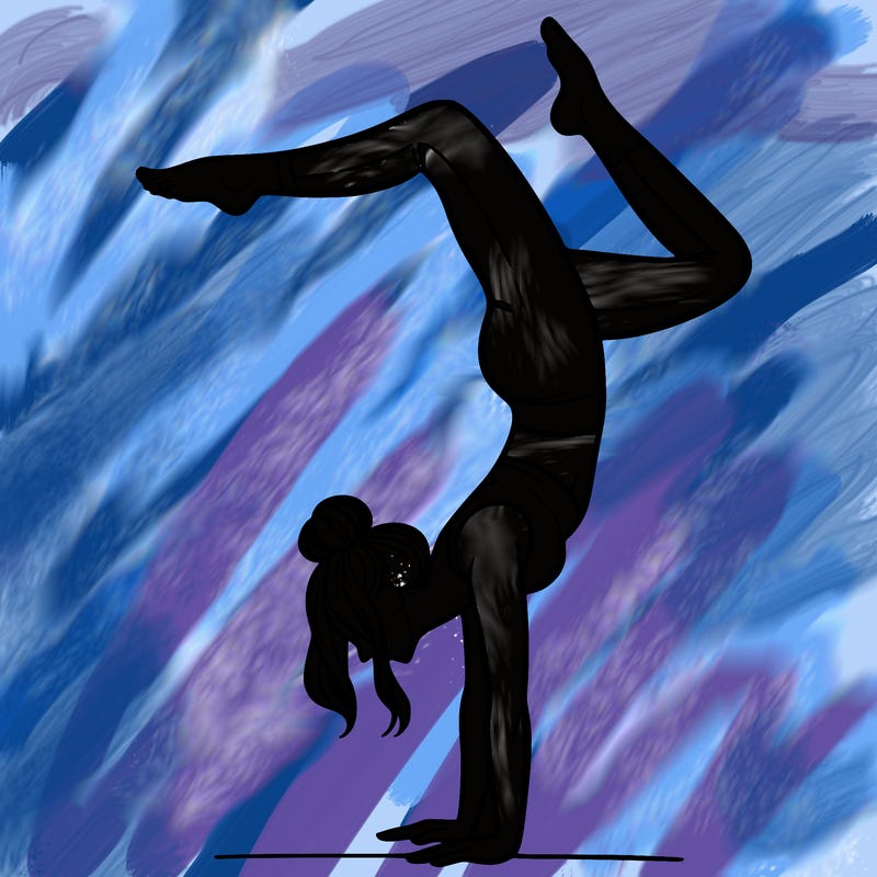 a woman doing a handstand