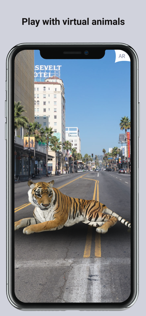 ARLOOPA: Scan & Discover AR - A 3D augmented reality tiger lying in the middle of a city street on a smartphone screen