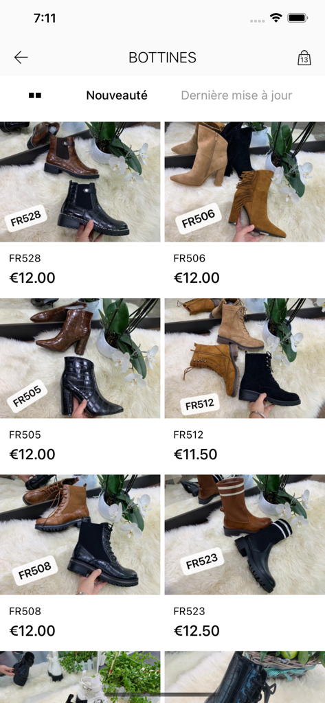 LOV'IT app interface displaying a wholesale catalog of various women's ankle boots with prices
