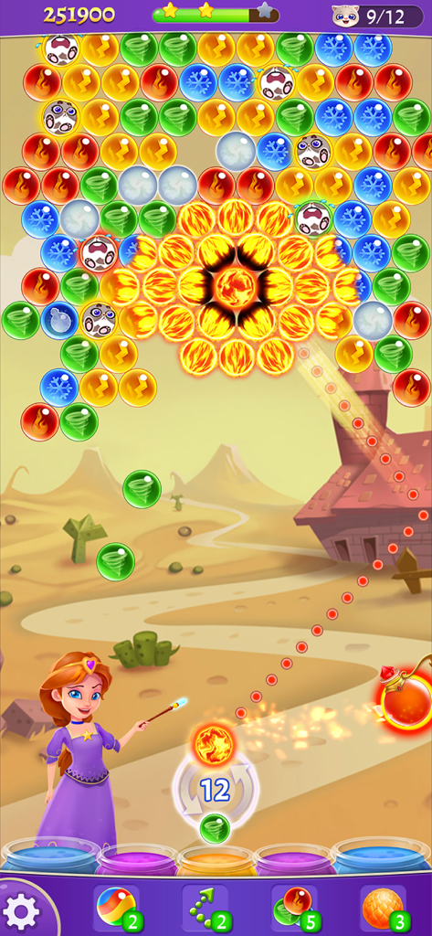 Bubble & Dragon - Prinzessin Alice zielt mit einem Blasenschuss, um Kätzchen im Spiel Bubble and Dragon zu retten