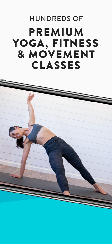 A woman performing a yoga side plank pose as part of the premium fitness and movement classes on the YouAligned app.