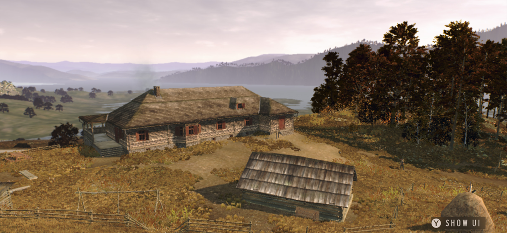 A scenic view of a wooden hunting lodge and outbuilding in a European mountain valley.