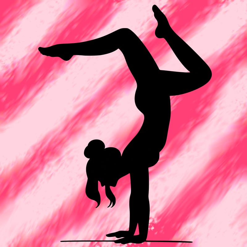 a woman doing a handstand
