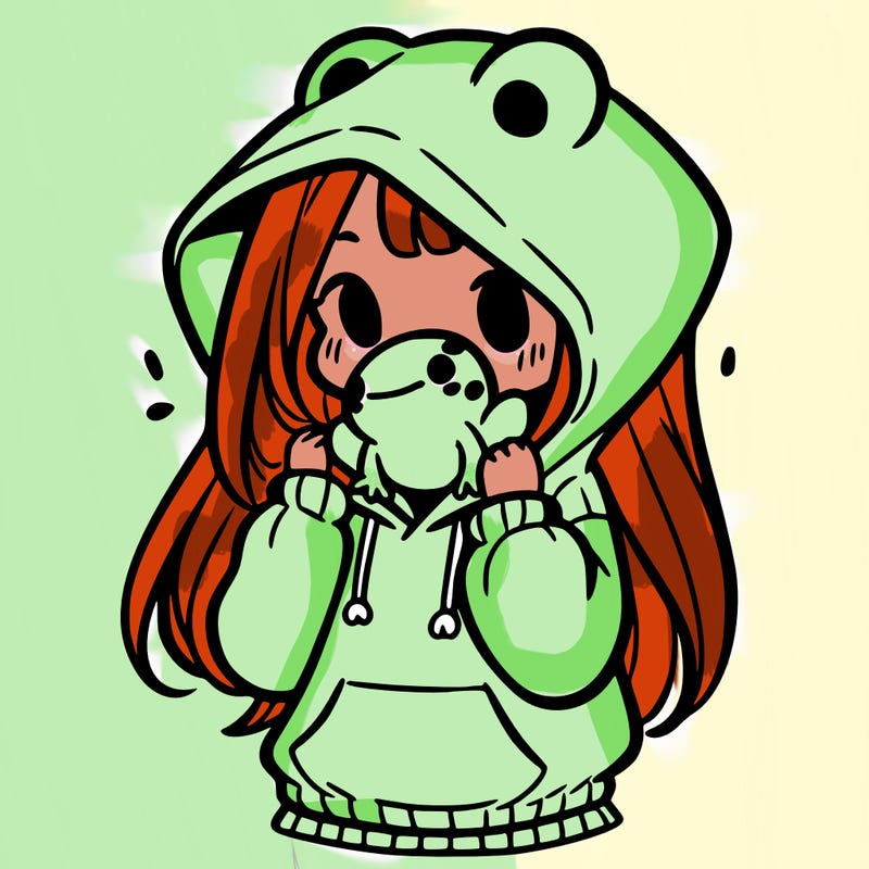 a girl holding a froggy hoodie