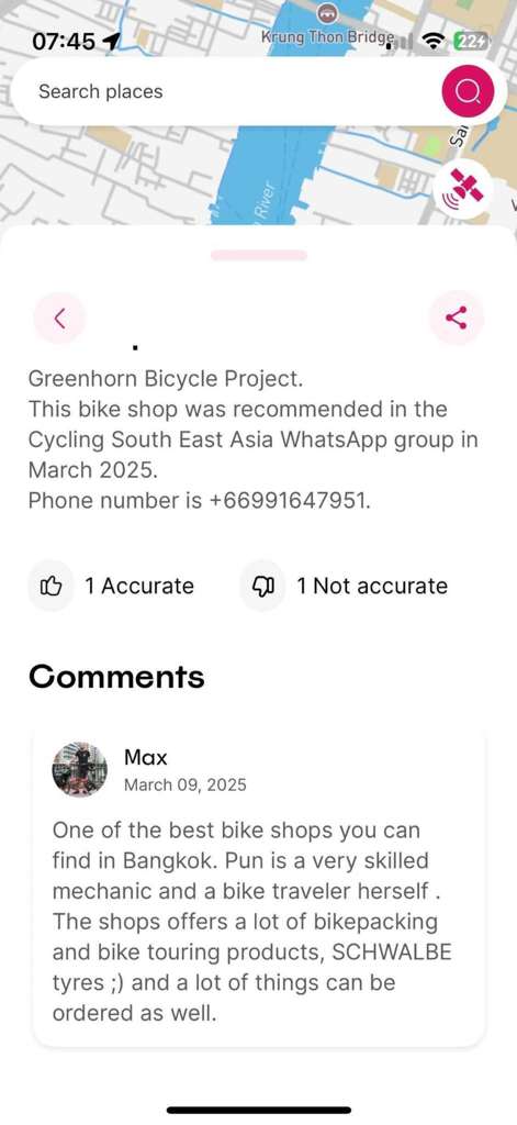 Rolling Around - Rolling Around app interface showing details for a bike shop waypoint with community reviews and accuracy ratings.