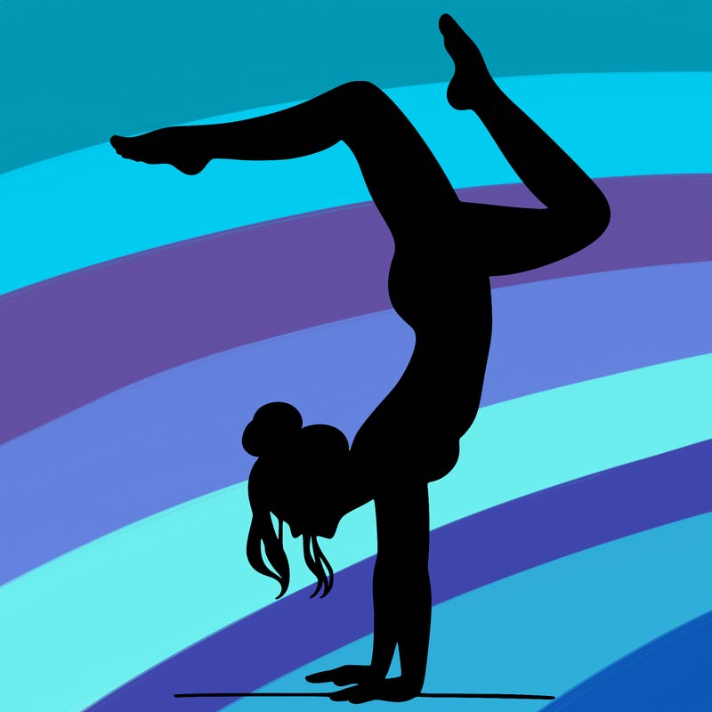 a woman doing a handstand