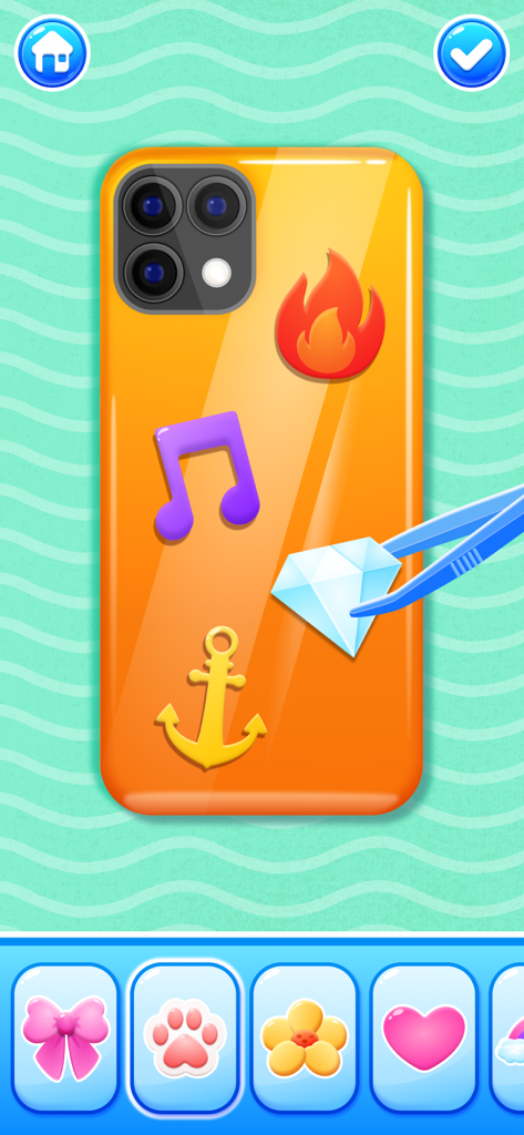 DIY 창의 게임에서 핀셋을 사용하여 주황색 폰 케이스에 다이아몬드 스티커를 붙이고 있습니다