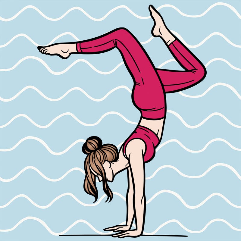 a woman doing a handstand