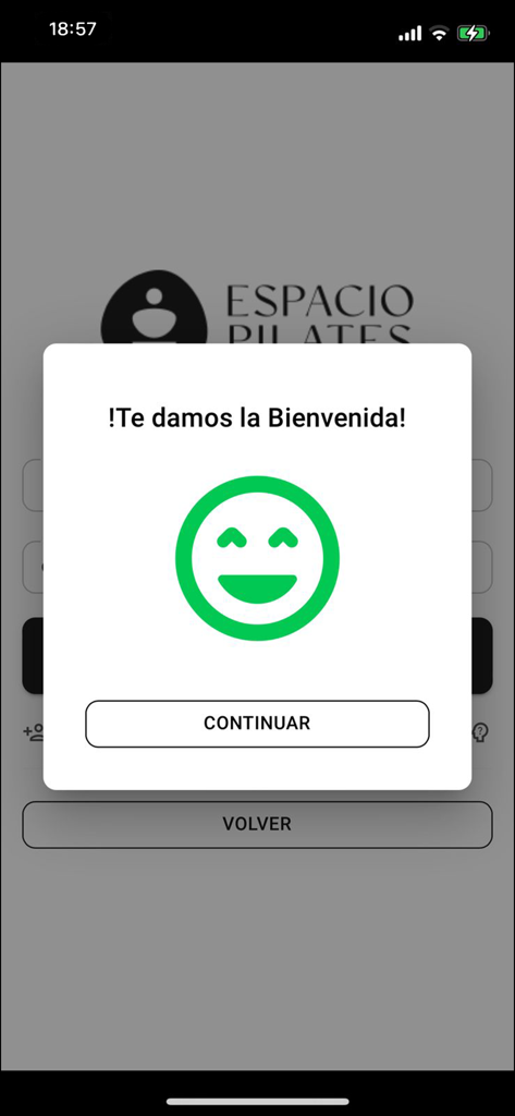Espacio Pilates - Espacio Pilates app welcome screen with a green smiley face icon and a continue button