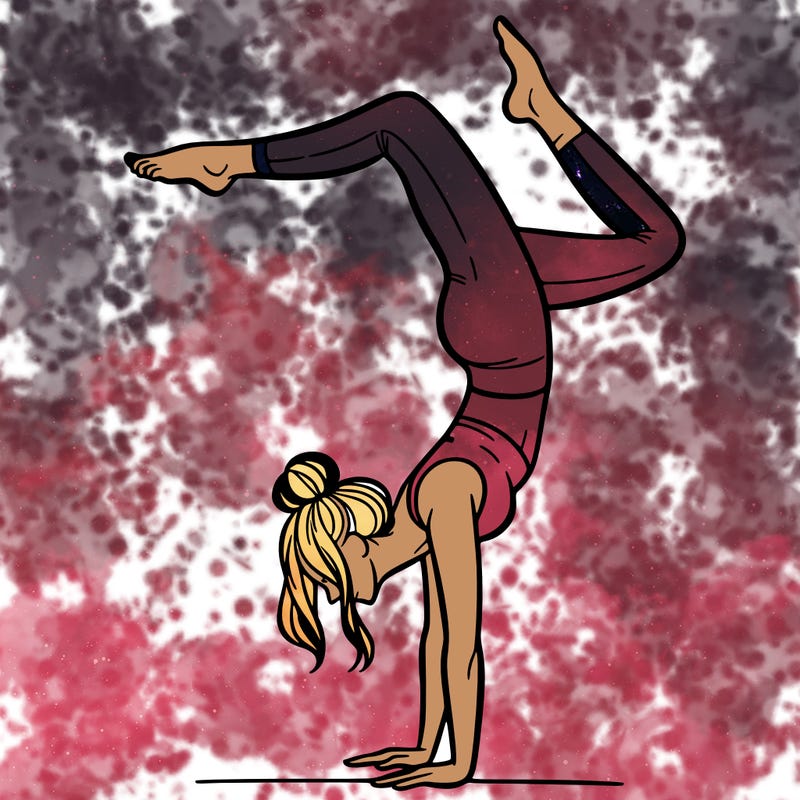 a woman doing a handstand