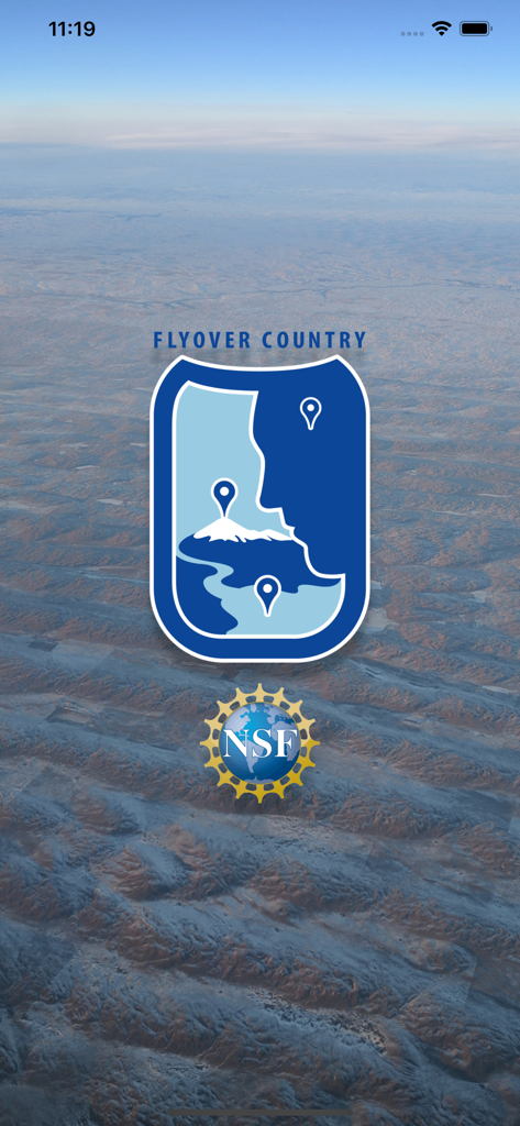 Flyover Country app splash screen with the NSF logo and a shield icon over an aerial landscape