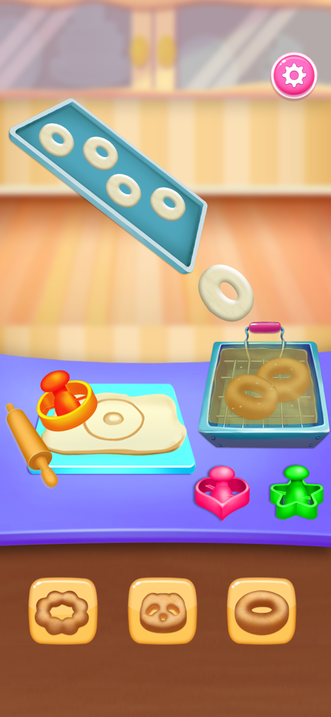 Ice Cream Cake & Baking Games - Gameplay screen of a kids baking game showing donut dough being cut and fried