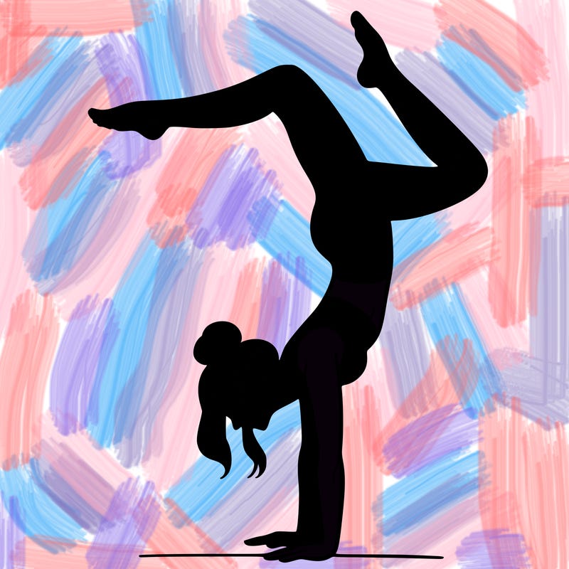 a woman doing a handstand