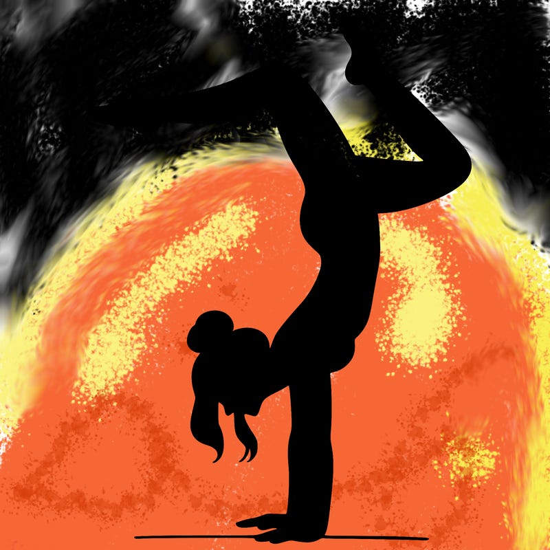 a woman doing a handstand