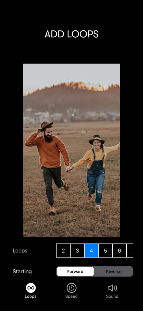 Interface of Boomerang Maker app showing options to add loops and reverse video direction for a couple running in a field